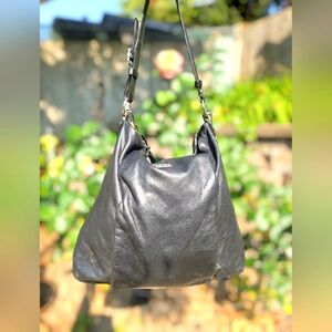 Coach Edie black leather hobo with purple satin lining